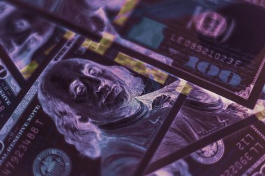 Close up Franklin's face on a one hundred dollar. American, US Dollars Cash Money in neon light.Minimalism retro style concept. 80s. Background pattern for design.	