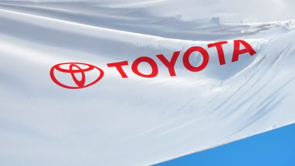 Toyota manufacturer flag in slow motion, editorial animation — Stock Video