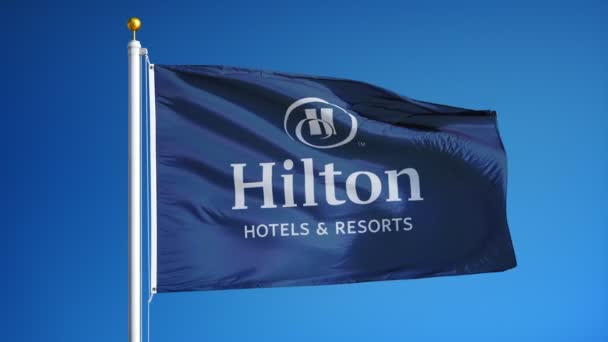 Hilton Hotels Resorts company flag in slow motion, editorial animation — Stock Video