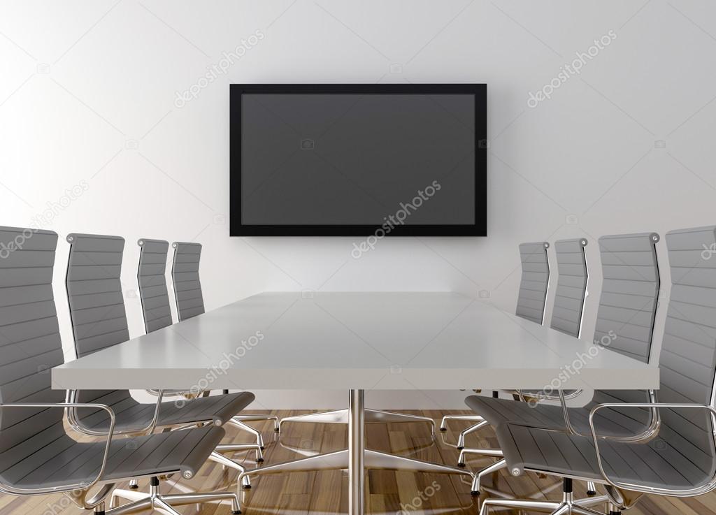 Conference room with blank LCD TV in background