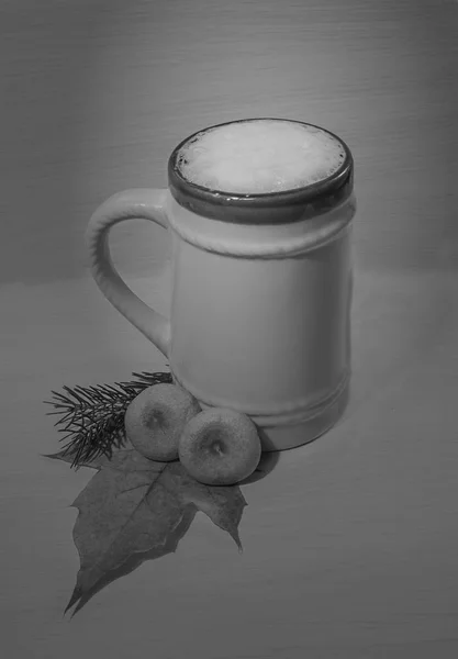 black and white picture of a beer mug and mushrooms