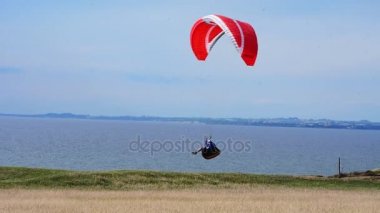 Paraglider flying over Hammars Backar, Sweden