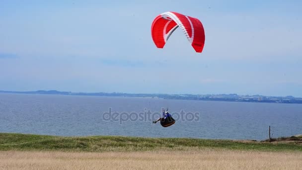 Paraglider flying over Hammars Backar, Sweden — стокове відео