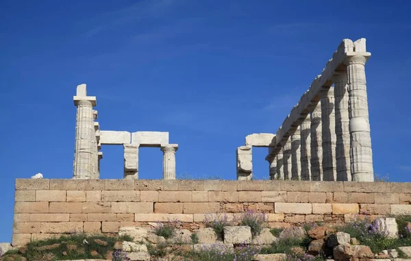 The ruins of the Temple of Poseidon at the legendary Cape Sounion in Greece. Among some historians, it is believed that the Temple of Poseidon was built by the inhabitants of the mysterious Atlantis, and not by the Greeks, back in 440 BC.