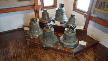 Exhibits of the Lutsk Castle (Lubart Castle), Volyn, Ukraine. Unique exposition of bells. clipart