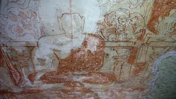 Fresco of Buddha.Buddhist cave temple-monastery complex Kanheri (near Borivali, a suburb of Mumbai in India). Ancient temples were carved by the hands of worshipers of Buddha. The complex has 109 caves