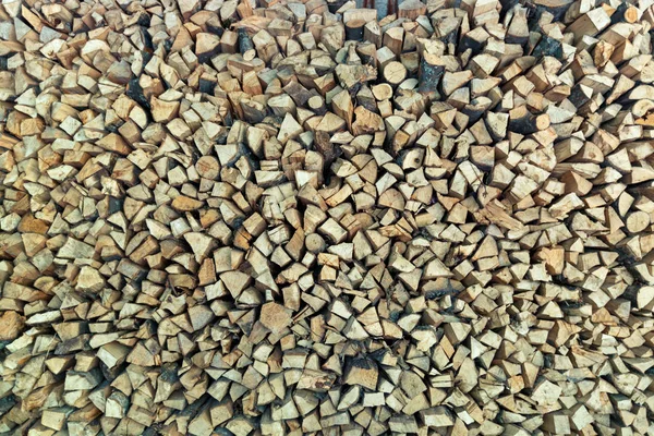 Pile of stacked firewood prepared for fireplace — Stock Photo, Image