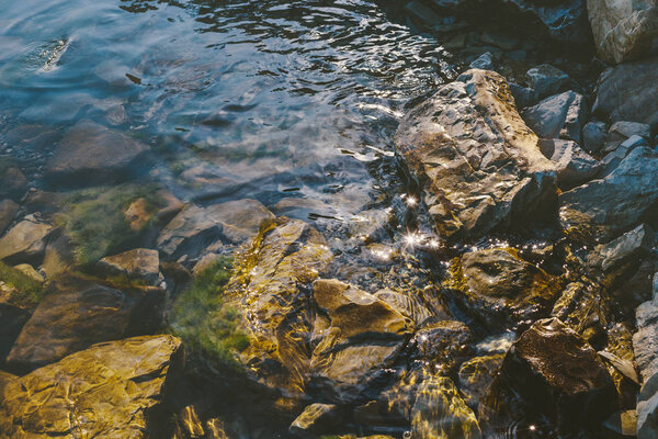 Picturesque Stone Seashore, Reflection Of The Sun Rays On The Water. Recreation Leisure Journey Concept