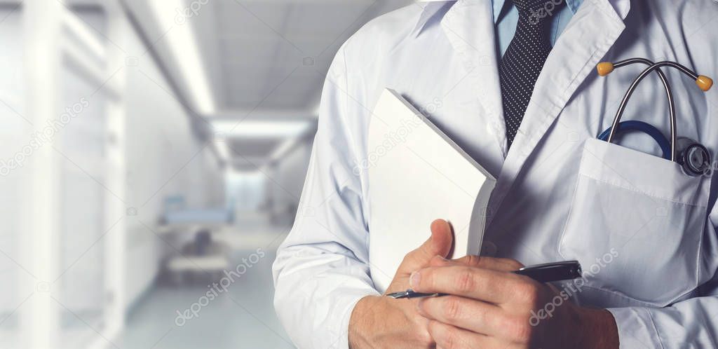 Doctor With Stethoscope Keeps Medical Journal. Healthcare Medicine Concept