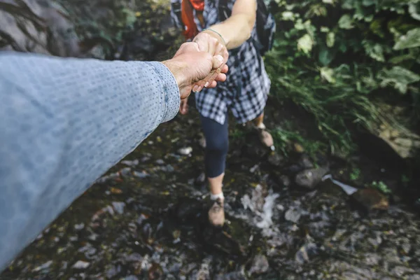 Close-up Of Helping Hand, Hiking Help Each Other. Focus On Hands. People Teamwork Hiking With Motivation And Inspiration. Wide angle lens