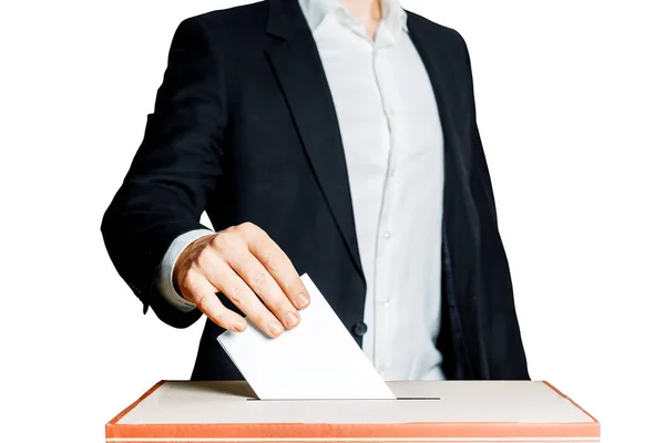 Hombre poniendo una papeleta en una urna sobre fondo blanco. Concepto de libertad democrática — Foto de Stock