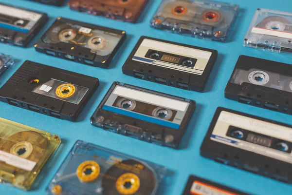 Collection Of Retro Audio Tapes On Blue Background. Retro Technolody Music Concept