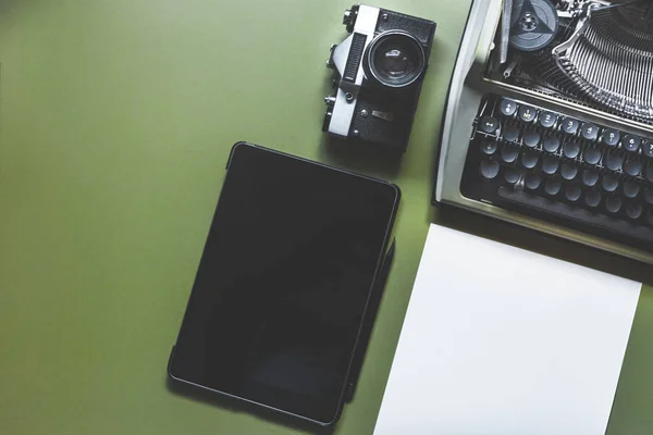 Analog Typewriter, Digital Tablet And Film Camera On The Green Table, Top View