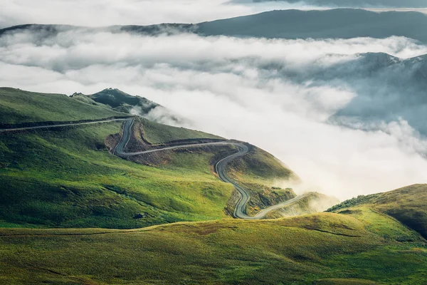 Road Trip Vacation Concept. Winding Road In The Mountains Near Background Of Clouds — Stock Photo, Image
