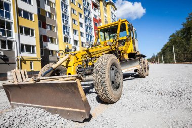 bulldozer working at the construction site clipart