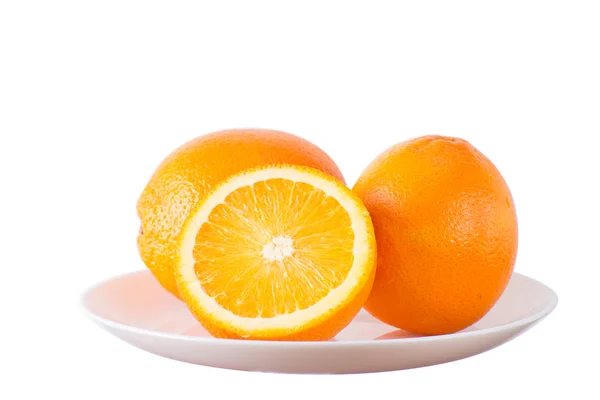 Oranges on white plate — Stock Photo, Image