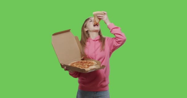 Caucasian female eating slice of delicious cheese pizza — Stock Video