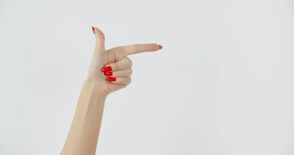 Manos de mujer apuntando al copyspace — Foto de Stock