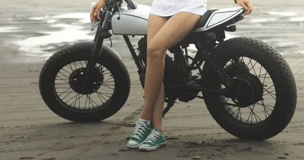 Young woman biker with custom cafe racer — Stock Photo, Image