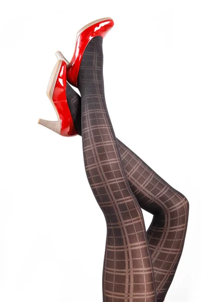 Ženské nohy nosí punčocháče a vysoké podpatky — Stock fotografie