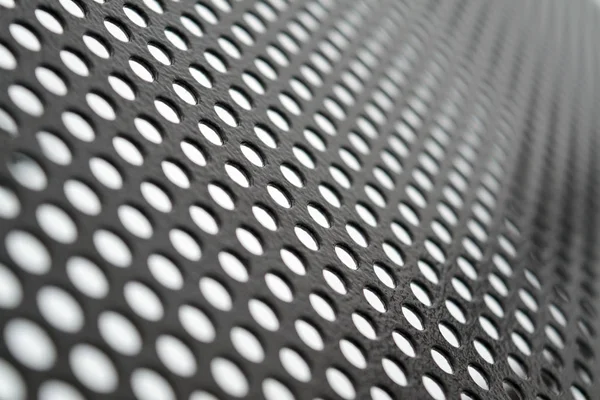 Textura perforovaného kovového plechu abstraktního pozadí. Detailní textura pozadí šedý plech perforované. — Stock fotografie
