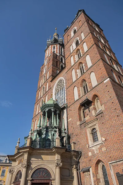 Architectural fragments of Brick Gothic St. Mary\'s Basilica (Church of Our Lady Assumed into Heaven or Kosciol Mariacki). Built in early XIII century Church is main landmark of city. Kracow, Poland.