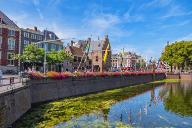 THE HAGUE, NETHERLANDS - AUGUST 23, 2019: City center view of The Hague in Netherlands with pond Hofvijver (Court Pond) near historical Binnenhof (Inner Court). 