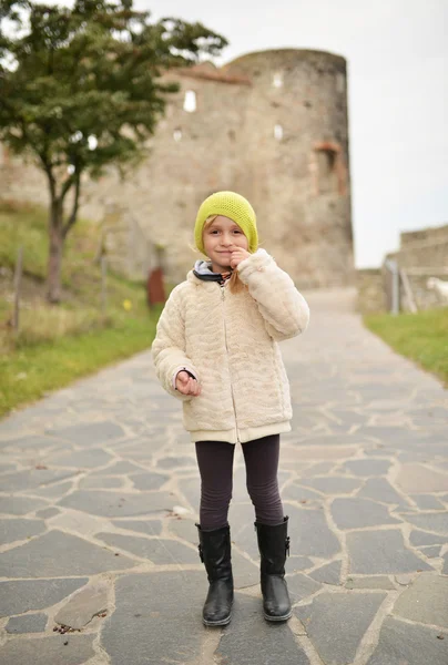 Little Girl White Coat Cap Walks Park — стоковое фото