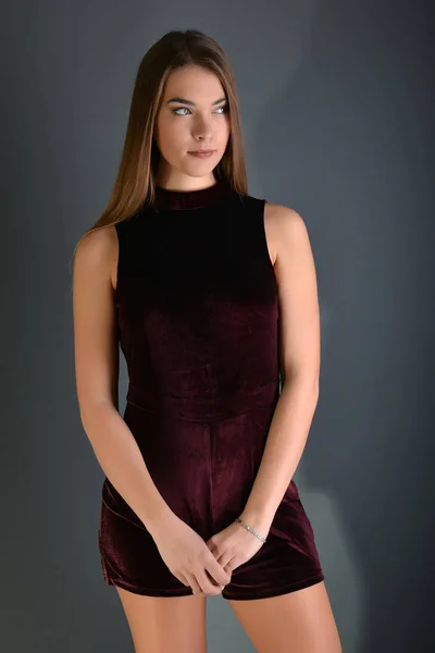 Beautiful sexy white woman in black dress posing at studio — Stock Photo, Image