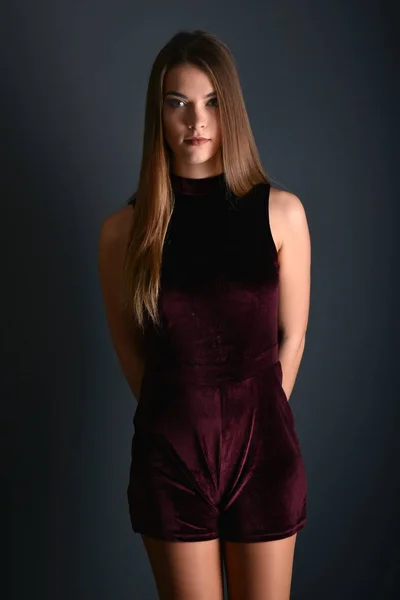 Beautiful sexy white woman in black dress posing at studio — Stock Photo, Image