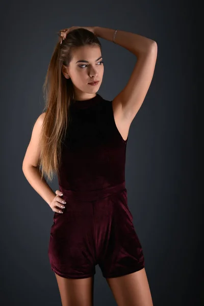 Beautiful sexy white woman in black dress posing at studio — Stock Photo, Image