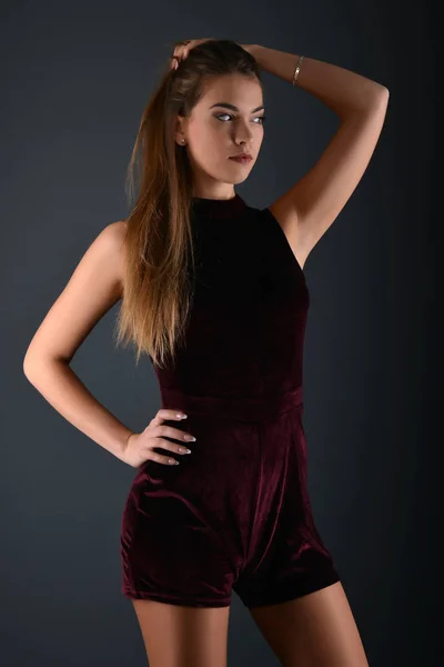 Beautiful sexy white woman in black dress posing at studio — Stock Photo, Image