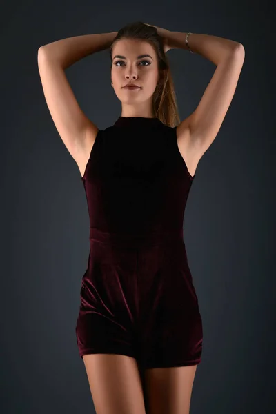 Beautiful sexy white woman in black dress posing at studio — Stock Photo, Image