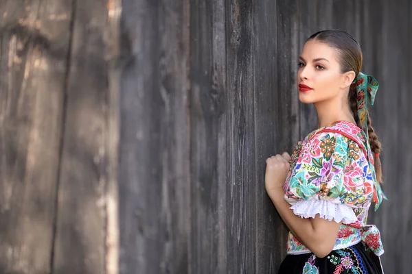 Young beautiful slovak folklore woman in traditional costume