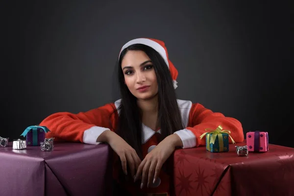 Smiling attractive young woman in santa claus costume. Smiling attractive young woman in santa claus costume