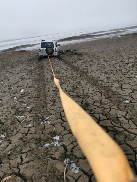 Towed car stucking in the swamp, extreme offroad