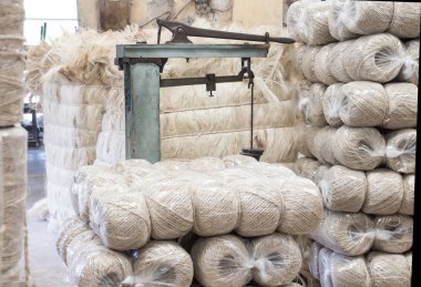 Image of a scale with a finished and packed rope in an old factory of henequen rope (fourcroiydes agave) clipart