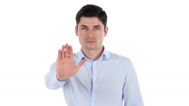 Стоп, против жеста руки предпринимателя, белый фон — стоковое видео