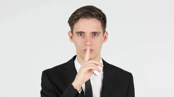 Geste de silence par homme d'affaires, doigt sur les lèvres — Photo