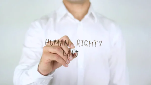 Закон о правах человека, бизнесмен пишет о стекле — стоковое фото