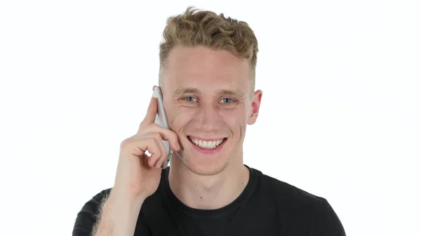 Νεαρός άνδρας σε λευκό φόντο μιλάμε στο τηλέφωνο — Φωτογραφία Αρχείου