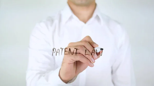 Ley de Patentes, Hombre Escribiendo en Vidrio —  Fotos de Stock
