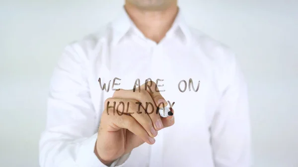 We Are On Holidays, Man Writing on Glass — Stok Foto