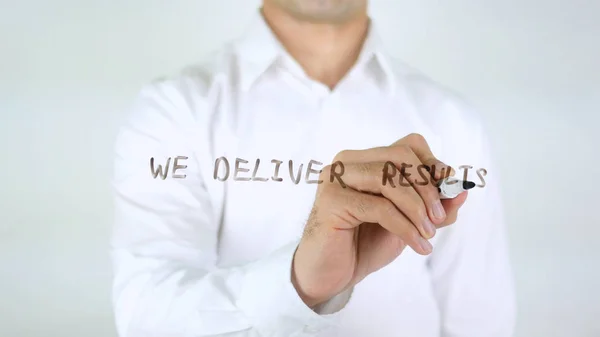 We Deliver Results, Man Writing on Glass — Stok Foto