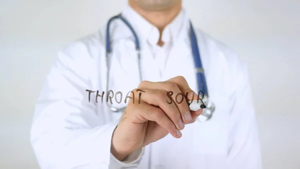 Zure keel, dokter schrijven op glas — Stockfoto