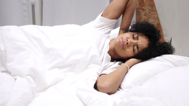 Afro-American Woman with Neck Pain Trying to Relax in Bed — Stock Video