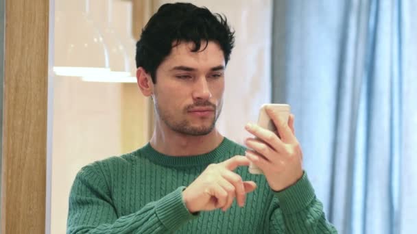 Young Afro-American Man Browsing Online on Smartphone — Stock Video