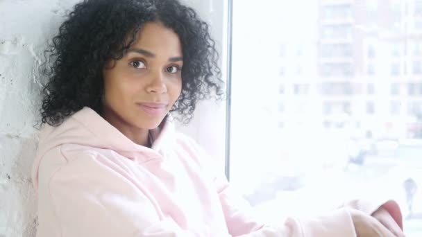 Young African Woman Waving Hand to Welcome, Sitting at Window — Stock Video