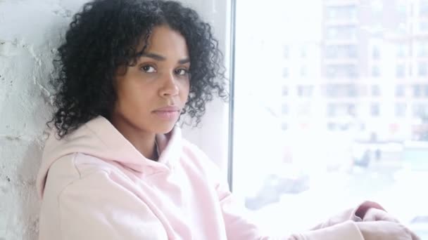 Silence Please, Young African Woman with Finger on Lips, Sitting at Window — Stock videók