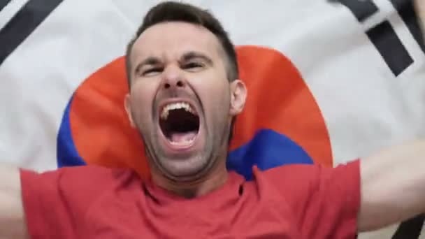 South Korean Fan celebrates holding the flag of South Korea in Slow Motion — Stock Video